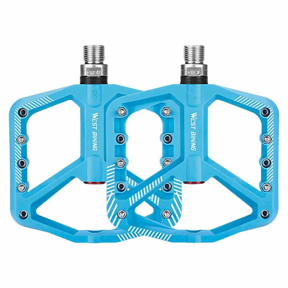 Blue wide bicycle pedals with non-slip surface and lightweight design