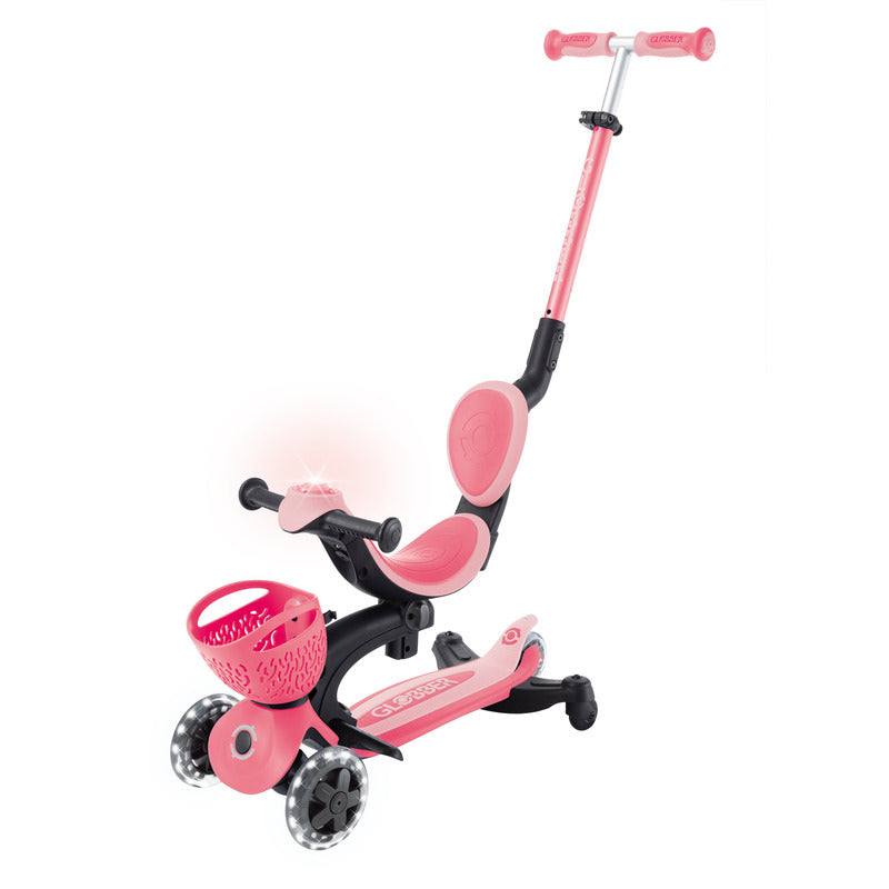 Pastel pink Globber Go Up Baby Lights 360 3-wheel convertible scooter and ride-on for toddlers with adjustable seat and handlebar, LED lights, and parent steering.